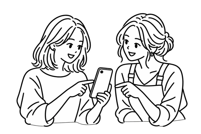 A woman discussing her hairstyle with a stylist while holding her phone